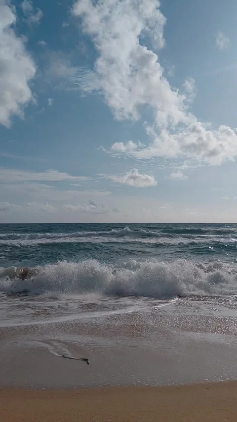 Soft turquoise sea ocean waves gently rolling onto a clean sandy beach. Stock Footage 341300942