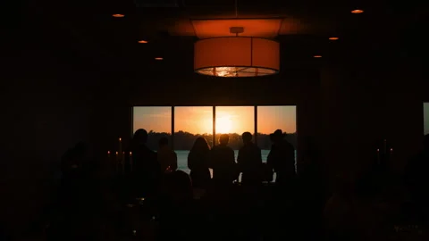 Soft unrecognizable silhouettes of random people in golden sunset light 库存影片 304370288