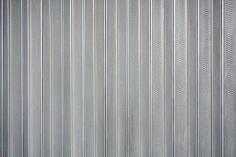 Soft vertical striped fabric texture with subtle folds and neutral gradient.. Stock Photos