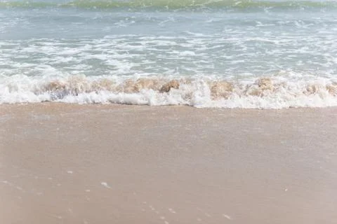 Soft ware on sand at the beach, copy space for text Photos