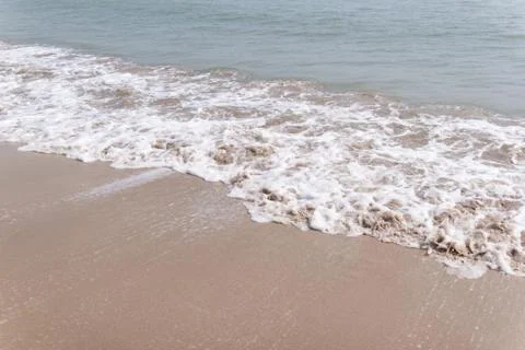Soft ware on sand at the beach, copy space for text Photos