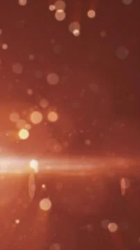 Soft warm bokeh lights and glowing rays on a reddish gradient background, c.. イラスト素材