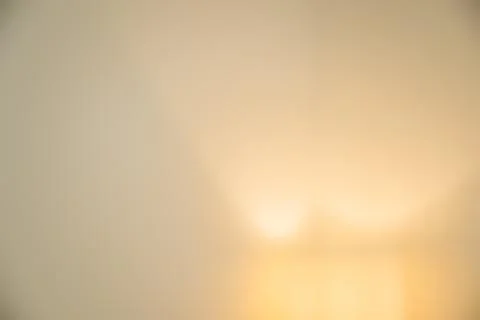 Soft warm gradient bokeh abstract background with golden glow Stock Photos