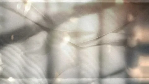 Soft Warm Light and Window Silhouettes on Grey Fabric Texture Background 動画素材 288180907