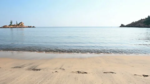 Soft wave and small island on the ocean Stock Footage 121577949