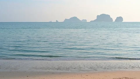 Soft wave with the blue ocean on a sandy beach. Video stock 152807195