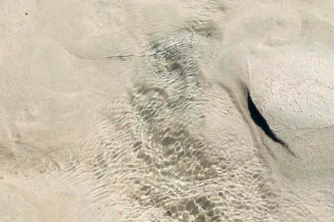 Soft wave of blue ocean on sandy beach. Stock Photos