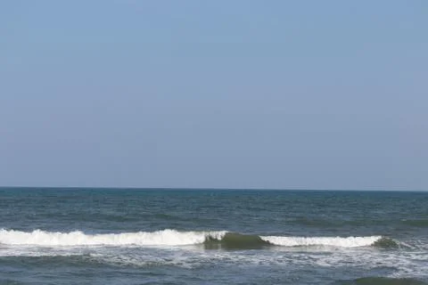 Soft wave of blue ocean on sandy beach.Summer beach and sea Stock Photos