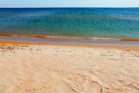 Soft Wave Of Blue Ocean On Sandy Beach. Background. Selective focus Stock-Fotos