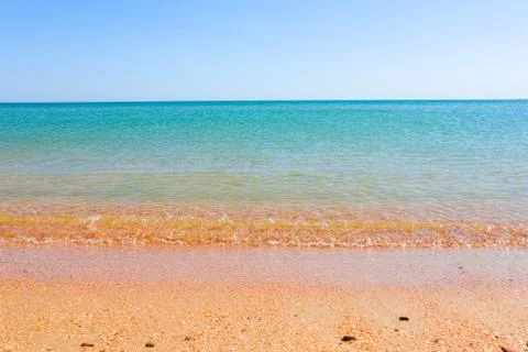 Soft Wave Of Blue Ocean On Sandy Beach. Background. Selective focus 스톡 사진