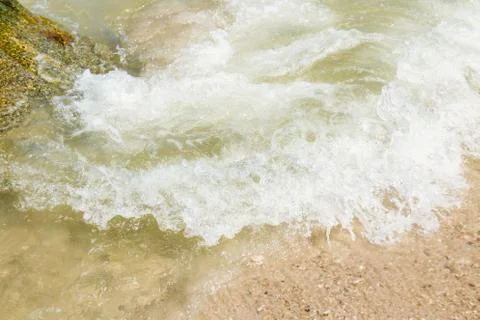 Soft wave of ocean on The beach background. Stock Photos