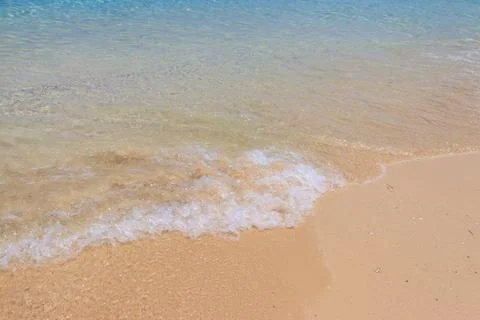 Soft wave of ocean on sandy beach 스톡 사진