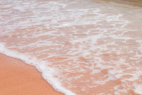 Soft wave on sand beach Stock Photos