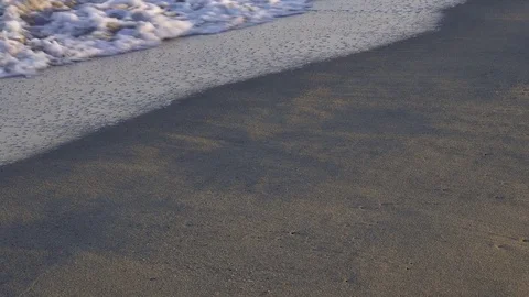 Soft wave on a sandy beach Stock Footage 74177679