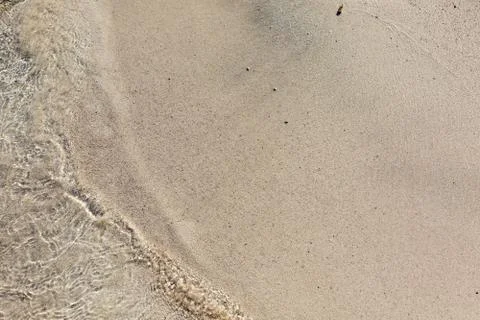 Soft wave of the sea on the beach Stock Photos