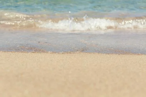 Soft wave of the sea on the beach Stock Photos