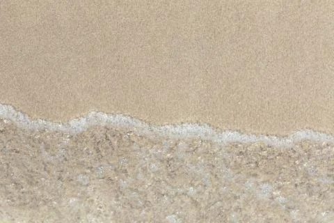 Soft wave of the sea on the beach Stock Photos
