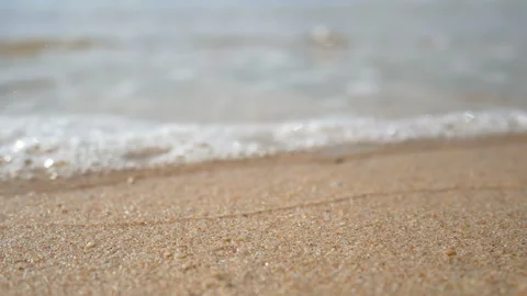 Soft wave of the sea, focus at the sand .clear water on the white sand beach Stock-Footage 134530083
