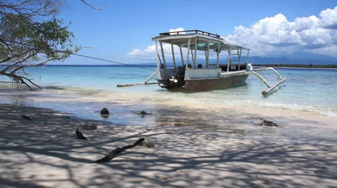 Soft wave of the sea on the sandy beach with boat, Gili Meno, Indonesia Stock Footage 37527468