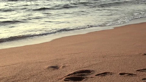 Soft wave of the sea on the sandy beach at the sunset loop Stock Footage 49672689