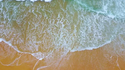 Soft waves of blue ocean on sandy beach background from top view from drones. Stock Footage 205080450