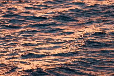 Soft waves  in a copper, and orange sunset light Stock Photos