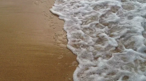 Soft waves on the golden sand Stock Footage 37734403