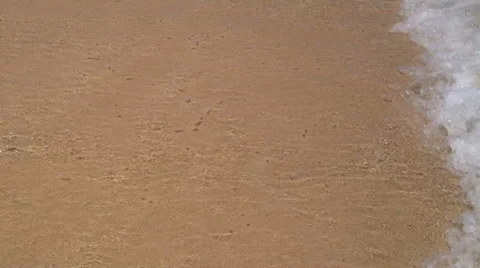 Soft waves on the golden sand Stock Footage 37826871