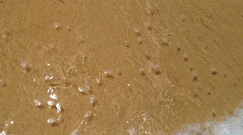 Soft waves on the golden sand Stock Footage 37832787