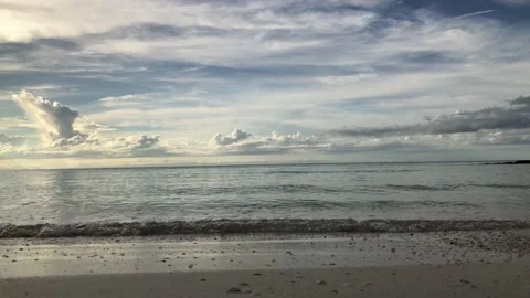 Soft waves in Holbox beach. Cloudy sunset. Swell Stock Footage 151559130