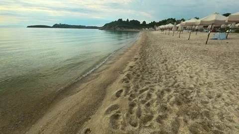 Soft waves lap golden sand. Trani Ammouda, Greece Stock Footage 339616829