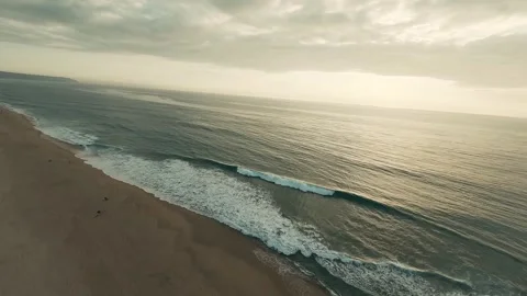 Soft waves roll onto golden sand Stock Footage 340227406