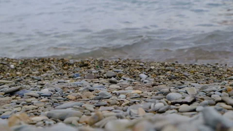 Soft waves in the sea, pebble beach Stock Footage 94951261