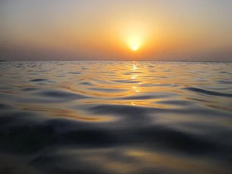 Soft waves in warm sunset Stock Photos