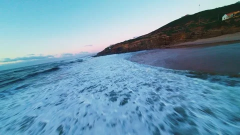 Soft waves wash warm sand at twilight Stock Footage 340915039