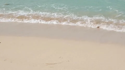 Soft waves washing over sandy beach. Beautiful sunny day at sea shore Stock Footage 139401170