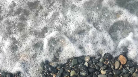 Soft waves with white foam on the beach Stock Footage 126318603