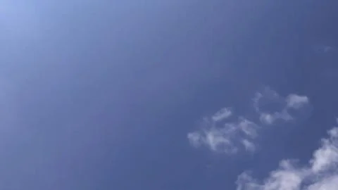 Soft White Cloud Formation in Bright Blue Summer Sky with Copy Space Fotos Stock
