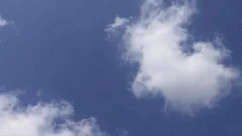 Soft White Cloud Formation in Bright Blue Summer Sky with Copy Space Fotos Stock