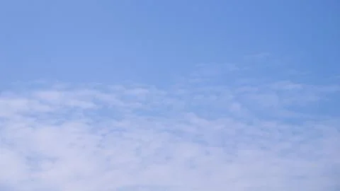 Soft White Cloud Pattern Across Clear Blue Sky Background Stock Photos