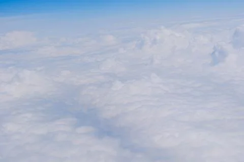 Soft white clouds above the sky Stock Photos