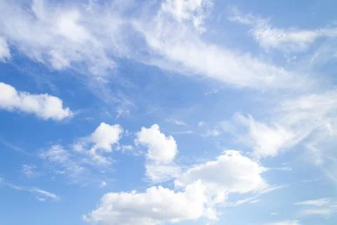 Soft white clouds against blue sky Stock Photos