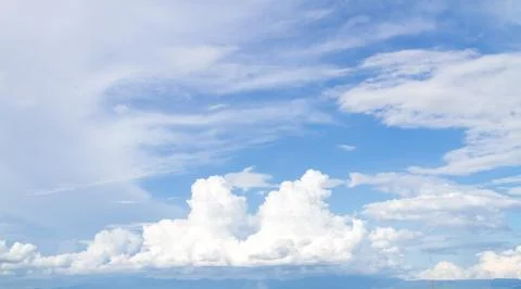 Soft white clouds against blue sky Stock Photos