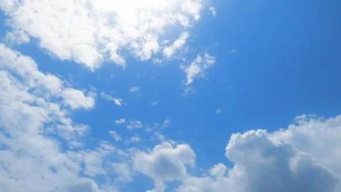 Soft white clouds against blue sky background Stock Photos