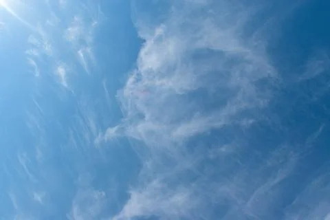 Soft white clouds against blue sky background. Stock Photos