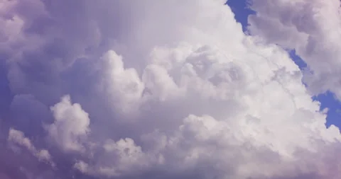 Soft White Clouds Against a Clear Blue Sky Stock Footage 336393397