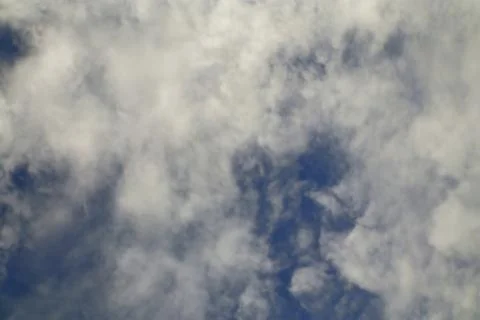 Soft White Clouds Against a Deep Blue Sky on a Sunny Day Weather Stock Photos