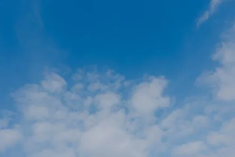 Soft white clouds in blue sky background Stock Photos
