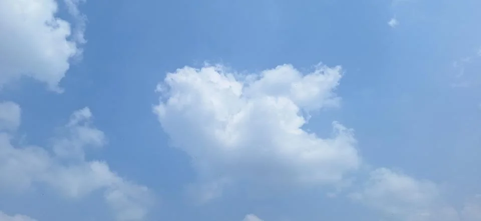 Soft White Clouds in Clear Blue Sky with Copy Space  Description - 1 Stock Photos