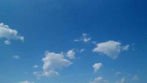 Soft white clouds. Clouds form against a dark blue sky. Blue sky white clouds Stock Footage 216056513
